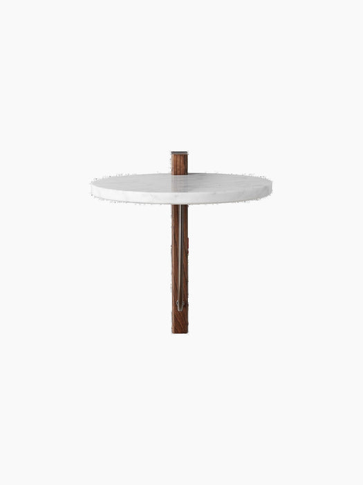 Front view of the Corbel Shelf, featuring a round white Carrara Marble top and a dark wood bracket with bronzed brass detail.