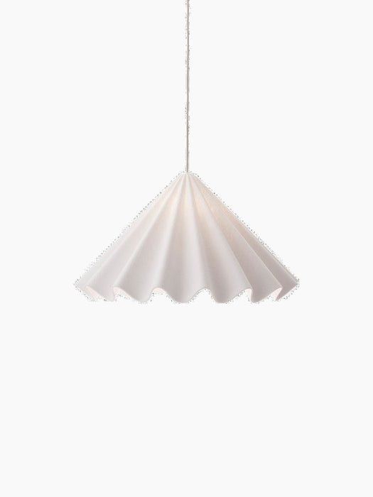 A front-on view of the illuminated white Dancing Pendant Lamp. Its felt shade is shaped like a swirling, pleated skirt.