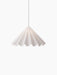 A front-on view of the illuminated white Dancing Pendant Lamp. Its felt shade is shaped like a swirling, pleated skirt.