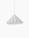 The white Dancing Pendant Lamp with a flared, pleated felt shade resembling a dancer's skirt, against a black background.