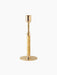 The Duca Candleholder in polished brass. It has a round base, an adjustable stem with a knob, and a rattan-wrapped handle.