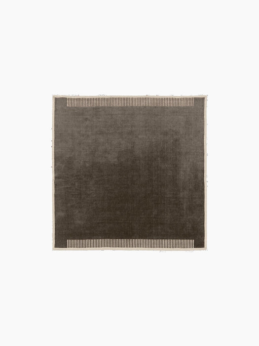 The Duomo Rug in Marble Grey. A square rug with a thin cream border and decorative vertical stripes on two edges.