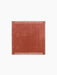 Aerial view of the square Duomo Rug in Terracotta Red with a thin, off-white border and decorative vertical stripe pattern.