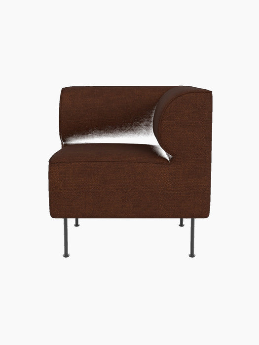 A three-quarter view of the Eave Dining Sofa Corner module in textured brown Audo Bouclé 08 upholstery on slim metal legs.