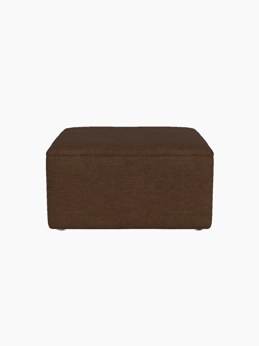 A side profile view of the Eave Modular Pouf, 75, upholstered in a textured brown Audo Bouclé 07 fabric on black background.