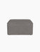 Front view of the square Eave Modular Pouf, 75, showing its piped seam. It is upholstered in grey Audo Bouclé 16 fabric.
