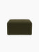 A front view of the Eave Modular Pouf, 75. The square pouf is upholstered in dark olive green fabric on a black background.