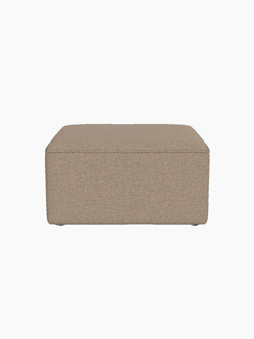 A front-facing view of the Eave Modular Pouf, 75. The square pouf is upholstered in a textured Logan Flint fabric.