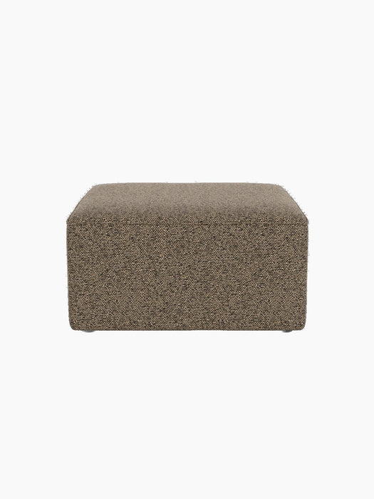 A front-on view of the square Eave Modular Pouf, 75, upholstered in a textured, two-tone beige and black Safire 001 fabric.