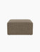 A front-on view of the square Eave Modular Pouf, 75, upholstered in a textured, two-tone beige and black Safire 001 fabric.