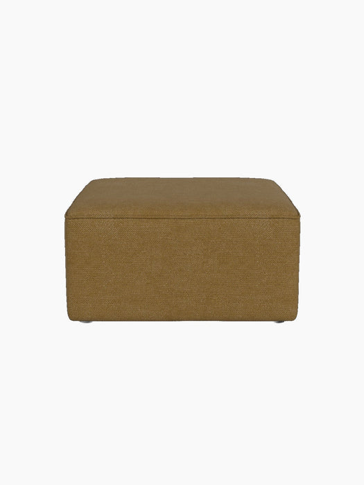 A front-on view of the Eave Modular Pouf, 75, a square ottoman upholstered in a textured, mustard-yellow bouclé fabric.