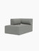 A three-quarter view of the Eave Modular Sofa, 86, Chaise Longue module upholstered in a light grey textured fabric.