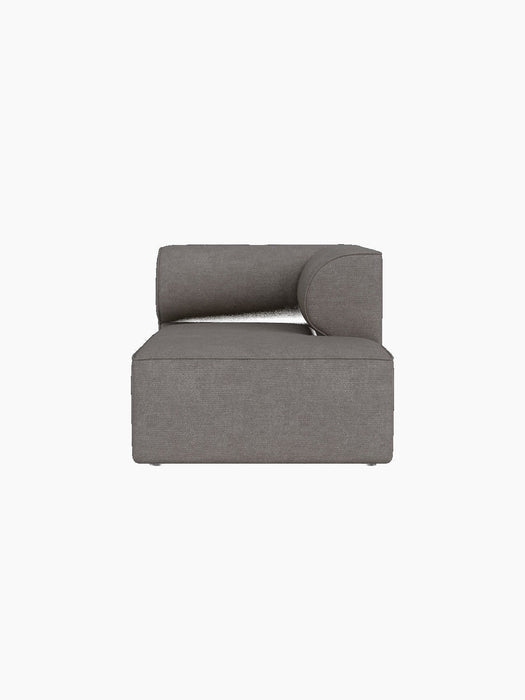 A front view of the Eave Modular Sofa Chaise Longue module, upholstered in a textured, grey-brown Audo Bouclé 16 fabric.