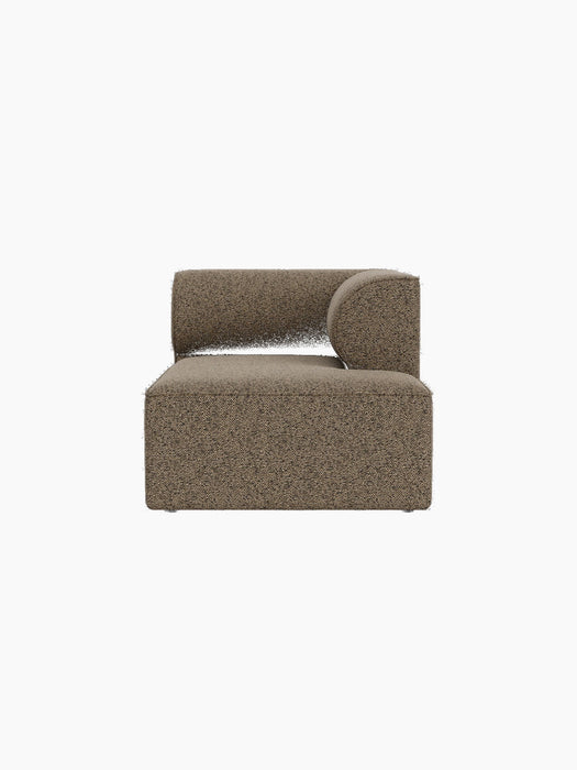 Front view of the Eave Modular Sofa Chaise Longue. The module has a low back and a curved armrest in brown bouclé fabric.