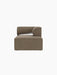 Front view of the Eave Modular Sofa Chaise Longue. The module has a low back and a curved armrest in brown bouclé fabric.