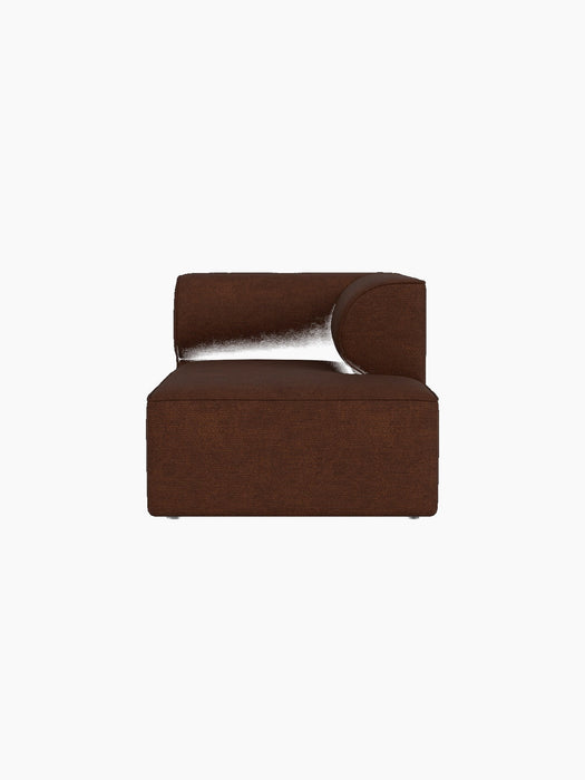 A front-facing view of the Eave Modular Sofa Chaise Longue, upholstered in a textured, dark brown Audo Bouclé 08 fabric.