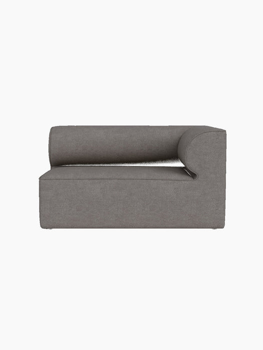 Front view of the Eave Modular Sofa, Corner 129 module, upholstered in grey Audo Bouclé 16 fabric on a black background.