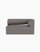 Front view of the Eave Modular Sofa, Corner 129 module, upholstered in grey Audo Bouclé 16 fabric on a black background.