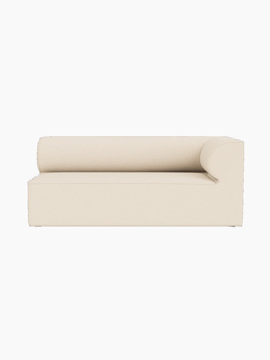 A front-on shot of the Eave Modular Sofa, 86, Corner 172, showing its light cream Logan Jasmine fabric and curved backrest.
