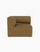 Side view of the Eave Modular Sofa 86 Corner in textured, brownish-yellow Audo Bouclé 06 fabric against a black background.