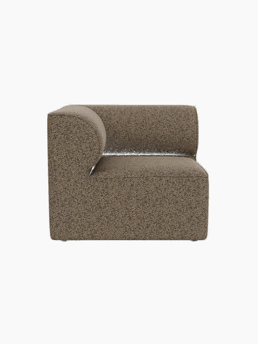 A side view of the Eave Modular Sofa, 86, Corner, upholstered in a textured brown fabric and isolated on a black background.