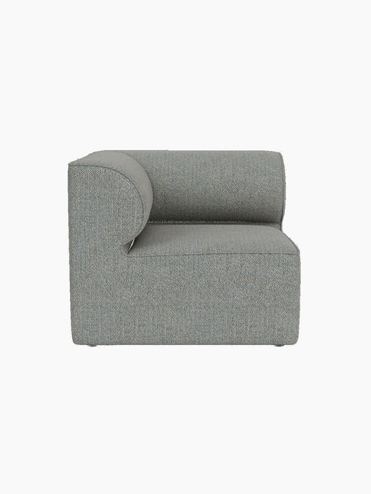 Top-down view of the Eave Modular Sofa, 86, Corner in light blue-grey textured fabric against a black background.