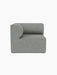 Top-down view of the Eave Modular Sofa, 86, Corner in light blue-grey textured fabric against a black background.