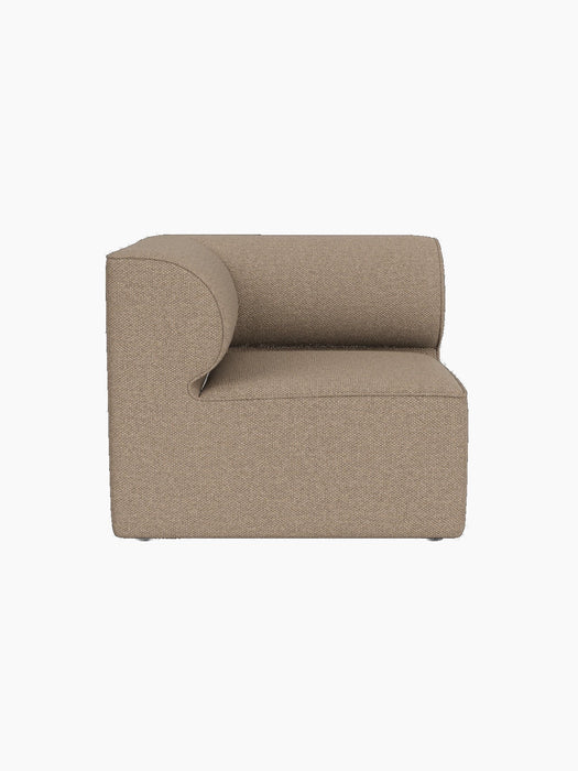 Side view of the Eave Modular Sofa, 86, Corner piece in textured Logan Flint fabric, showing its distinctive curved armrest.