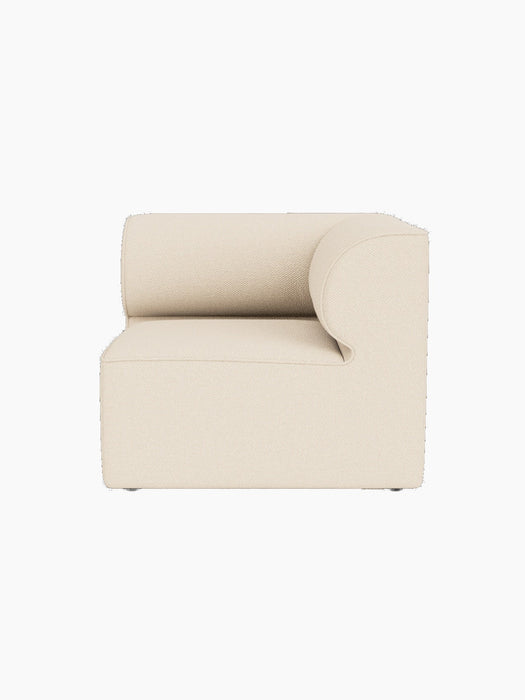 The Eave Modular Sofa's corner section in light-coloured Logan Jasmine fabric, viewed from above against a black background.