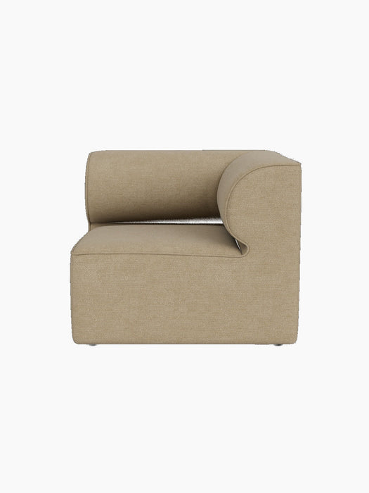 Side view of the Eave Modular Sofa, 86, Corner section in light beige Audo Bouclé 02 fabric against a black background.