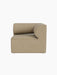 Side view of the Eave Modular Sofa, 86, Corner section in light beige Audo Bouclé 02 fabric against a black background.