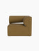 Side view of the Eave Modular Sofa, 86, Corner in Audo Bouclé 06, a textured golden-brown fabric, on a black background.
