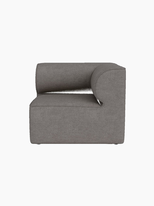 Eave Modular Sofa, 86, Corner module upholstered in grey Audo Bouclé 16 fabric, shown straight-on against a black background.