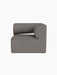 Eave Modular Sofa, 86, Corner module upholstered in grey Audo Bouclé 16 fabric, shown straight-on against a black background.