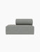 Front view of the Eave Modular Sofa, 86, Open End module in a light grey textured fabric, shown against a black background.