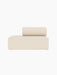 A front view of the Eave Modular Sofa, 86, Open End, upholstered in a cream-coloured, textured Logan Jasmine fabric.