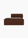 Side view of Eave Modular Sofa, 86, Open End module upholstered in brown Audo Bouclé 08 fabric against a black background.