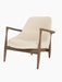 A three-quarter view of the Elizabeth Lounge Chair with walnut frame, sculpted armrests and Logan Jasmine upholstery.