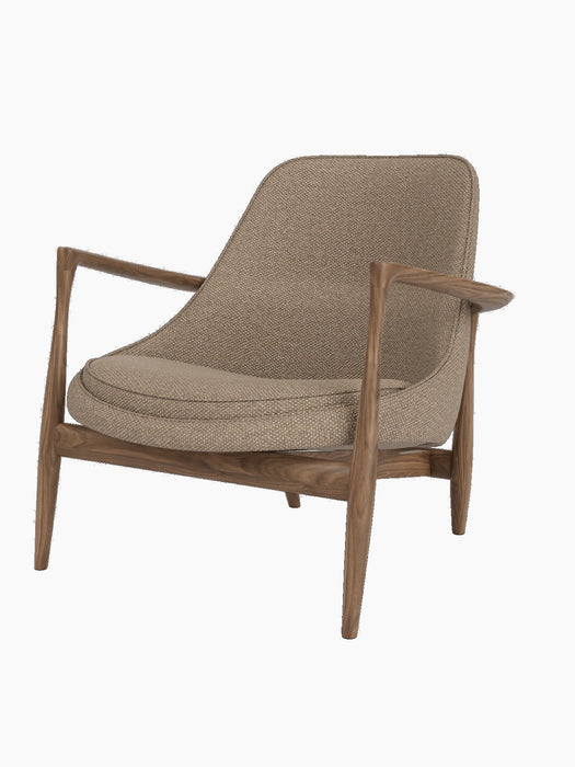 The Elizabeth Lounge Chair, featuring a dark walnut frame with sculpted armrests and Logan Flint upholstery.