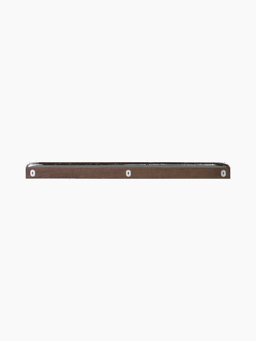 A back view of the dark brown wooden Échasse Shelf, showing its three silver metal wall-mounting points.