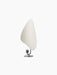 Angled view of the Flameau Candle Holder in bronzed brass and grey, featuring a sculptural base and large, white reflector.