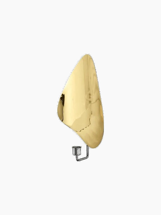 Flambeau Wall Candle Holder with an organic, polished brass backplate and a minimalist black metal candle socket.