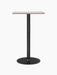 The Harbour Column Bar Table with a rectangular Kunis Breccia stone top and a slender black column with a round base.