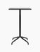 A front view of the Harbour Column Bar Table featuring a rectangular black oak top on a slender black column and a star base.