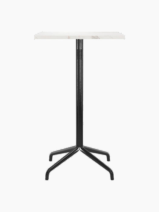 Front view of the Harbour Column Bar Table with a rectangular Estremoz marble top and a sleek black column with a star base.