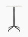 Front view of the Harbour Column Bar Table with a rectangular Estremoz marble top and a sleek black column with a star base.