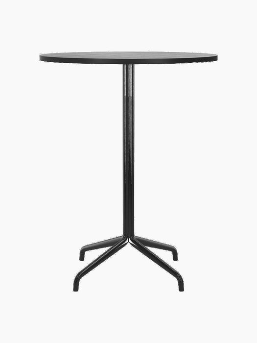 A front view of the Harbour Column Bar Table, featuring a round black oak top and a black column with a star-shaped base.
