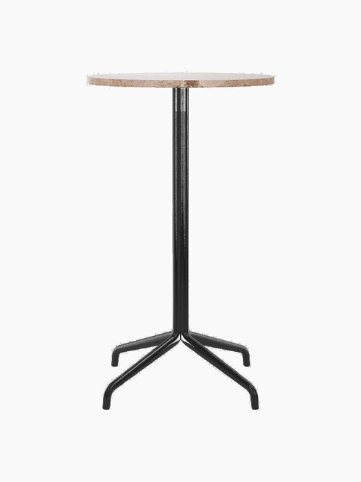 Front view of the Harbour Column Bar Table with a round Kunis Brescia stone top and a sleek black star-shaped base.