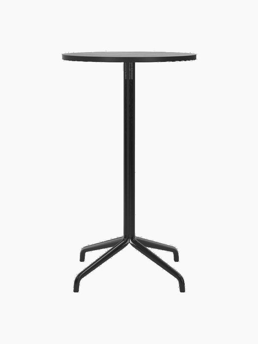 Front view of the Harbour Column Bar Table with a round black oak top, slender black central column, and a star-shaped base.