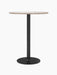 Front view of the Harbour Column Bar Table with a round Kunis Breccia stone top, on a slender black column and round base.